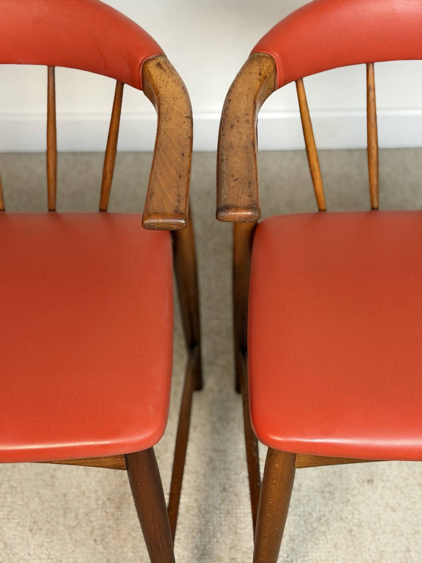 Pair of Scandinavian armchairs in teak and red faux leather – 1960s