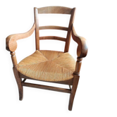 Antique armchair in solid wood with a straw seat.