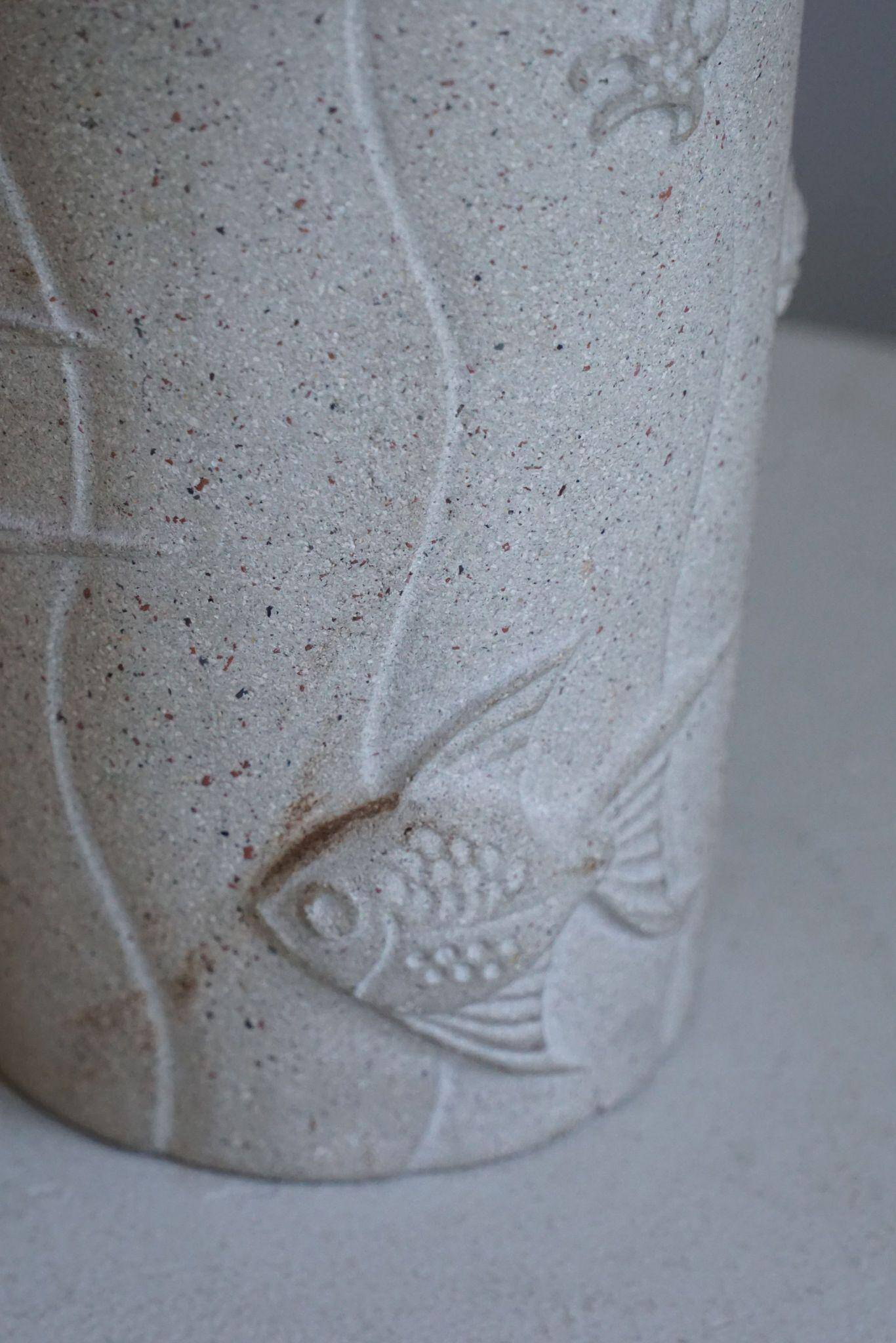 Modern vintage French table lamp, made of stone with fish patterns, 1970s.