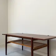 Vintage wooden coffee table with wicker lower shelf