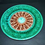 Antique plate in turquoise brown green slip with arabesque decoration