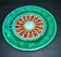 Antique plate in turquoise brown green slip with arabesque decoration