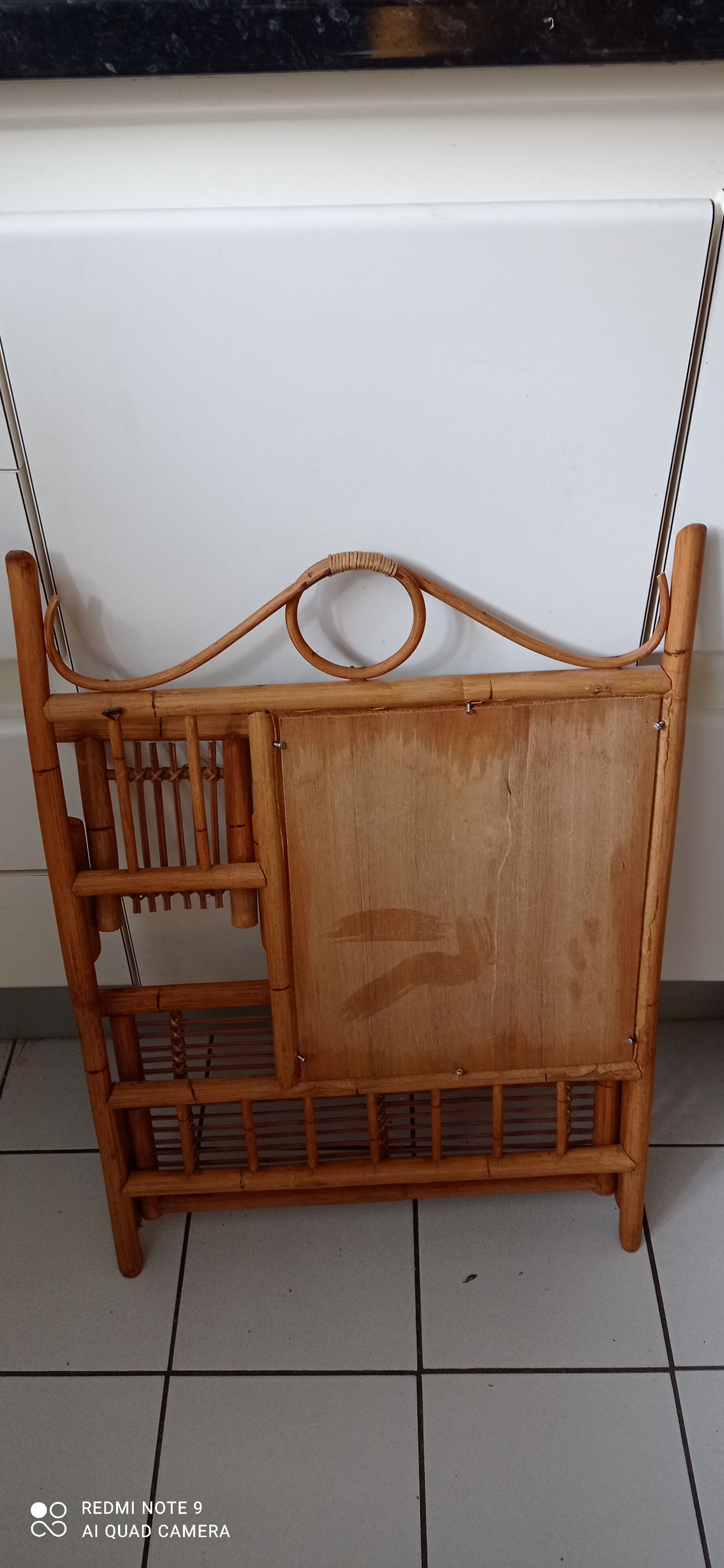Old bamboo and rattan mirror with vintage folding shelves