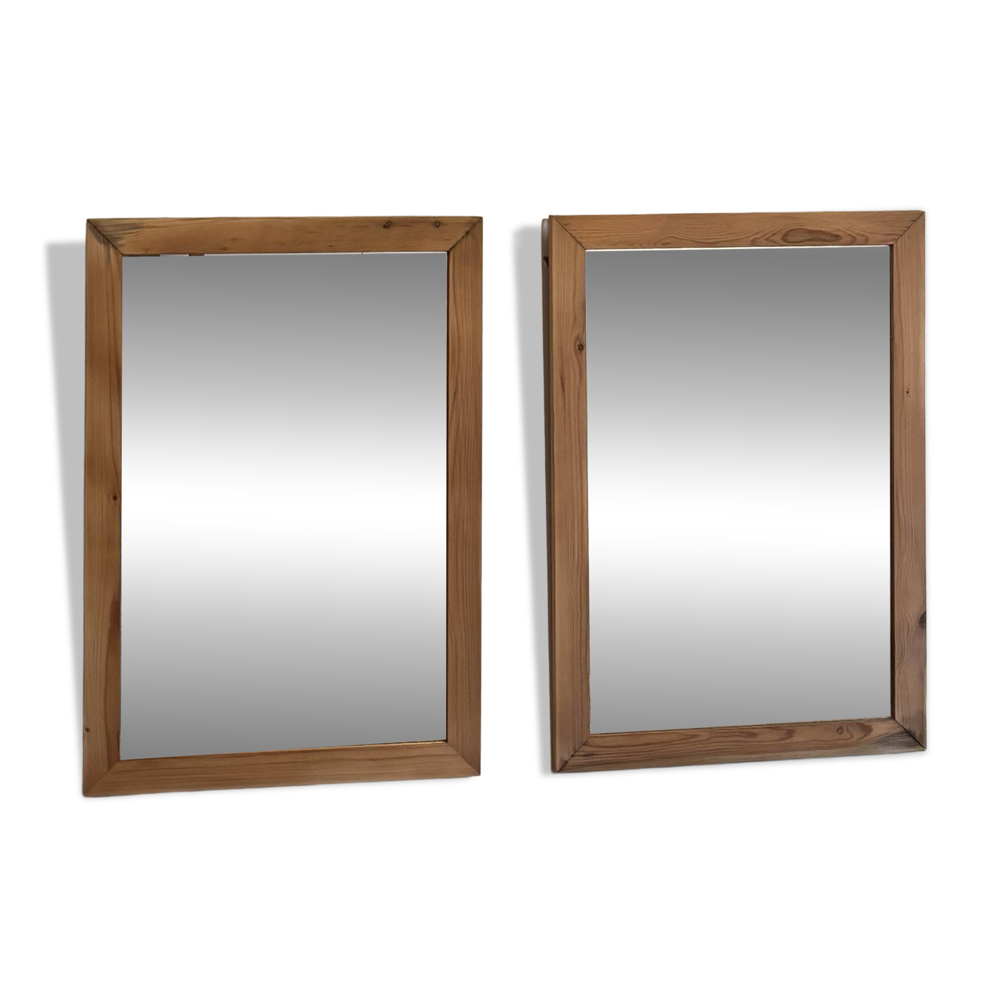 Pair of vintage antique mirrors in raw solid wood.