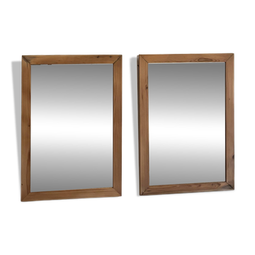 Pair of vintage antique mirrors in raw solid wood.