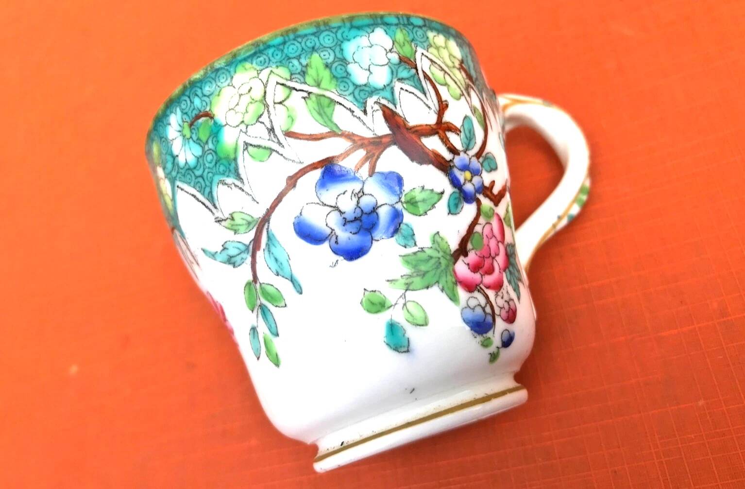 Antique porcelain cup in the Minton style with Japanese decoration.