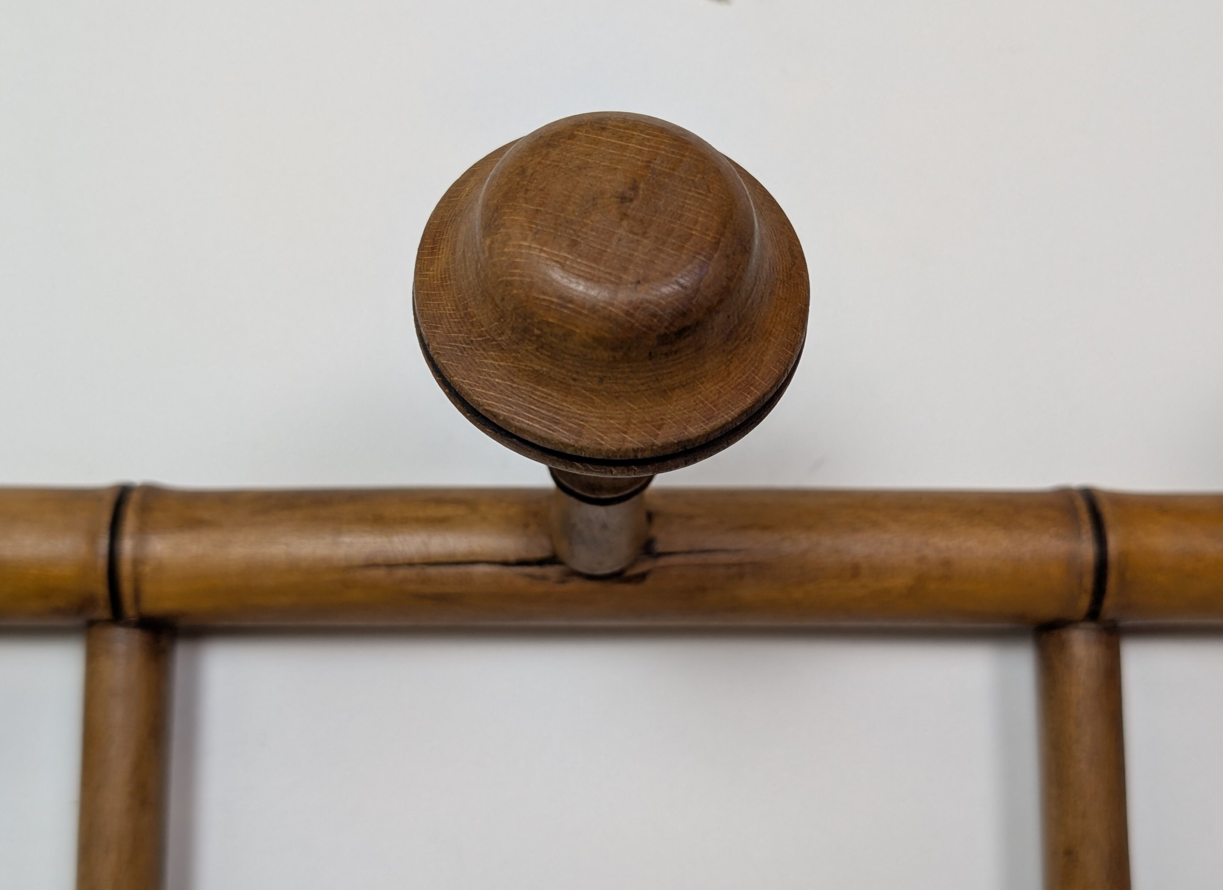 Wall-mounted coat rack made of turned wood