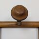 Wall-mounted coat rack made of turned wood