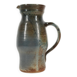 Handcrafted stoneware pitcher with blue-green hues, signed piece