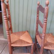 Pair of country-style straw chairs.