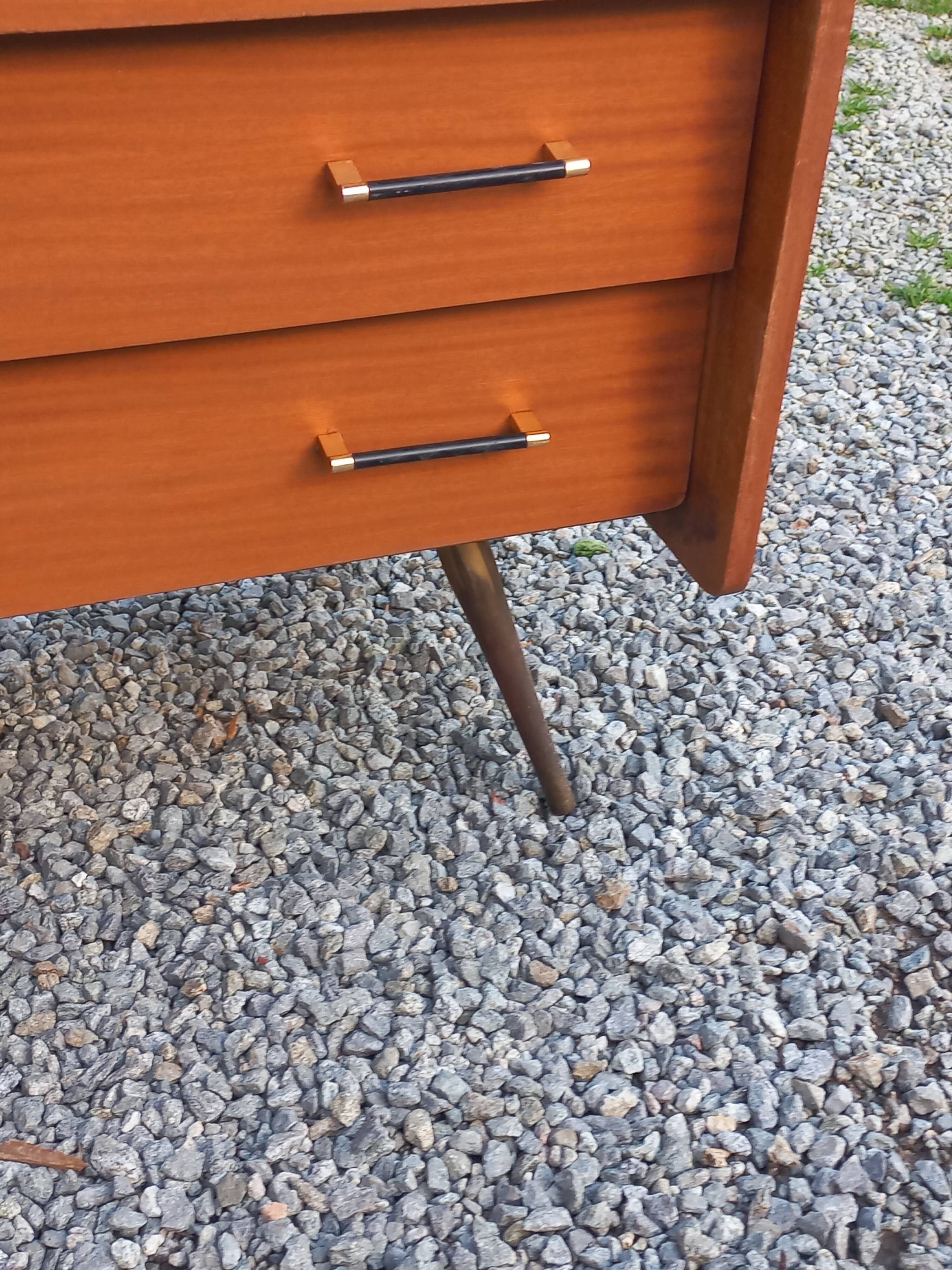 Vintage mahogany commode with metal tapered legs, 4 drawers, 1950s.