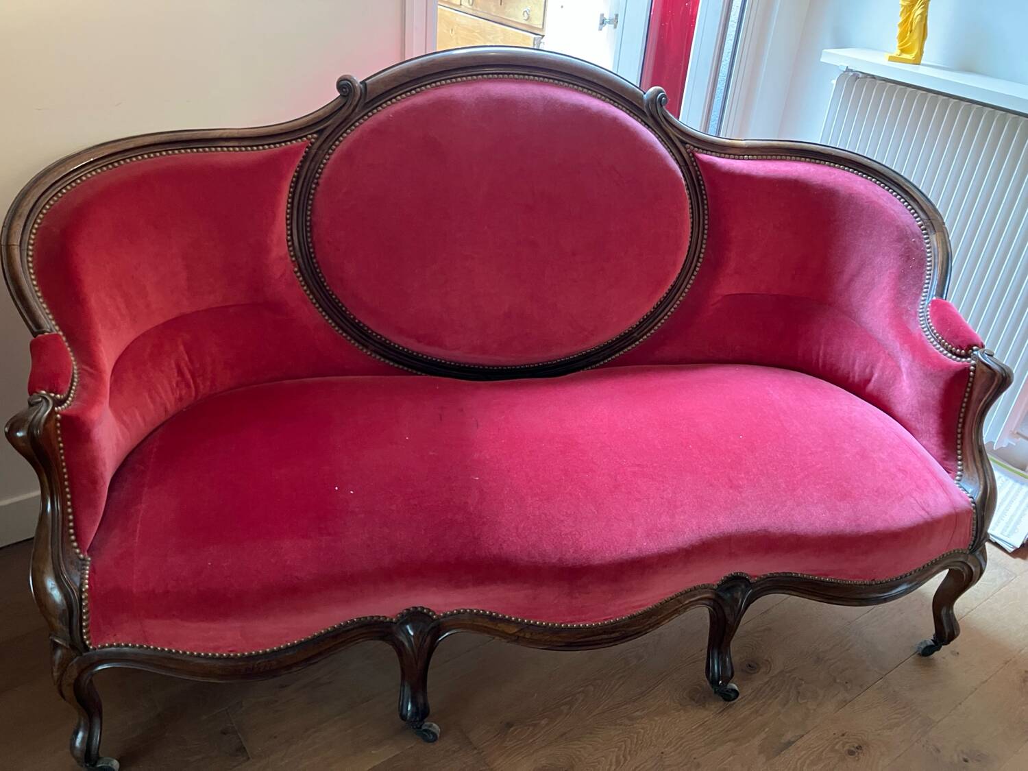 Moulded and carved wooden canapé, Napoleon III period.