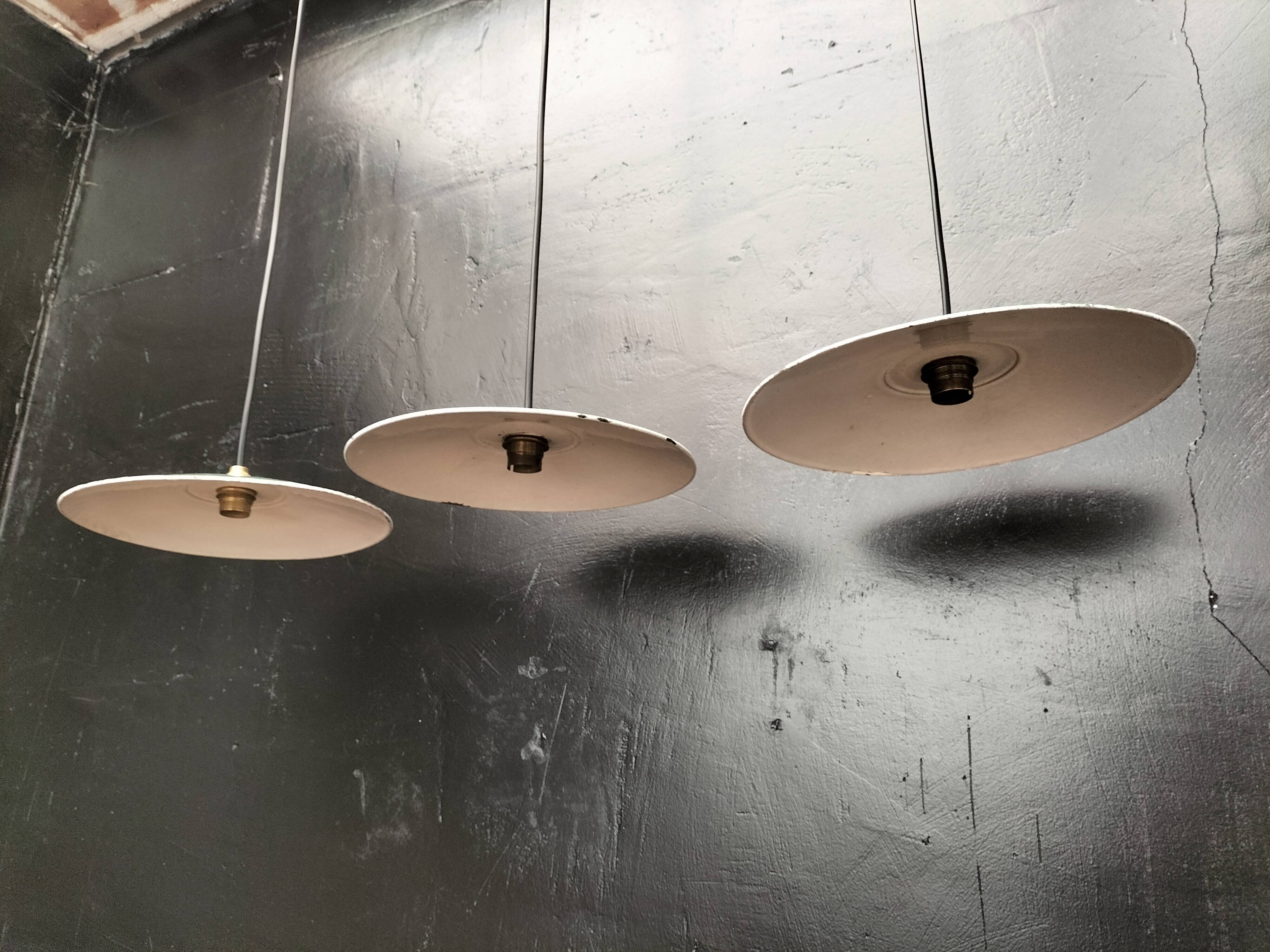 Three enamelled sheet metal suspensions