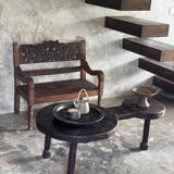 Small antique Indonesian bench in carved teak with plant and floral motifs.