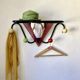 Wall coat rack, 1950s, attributed to Mathieu Matégot.