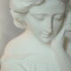 Limestone bust young girl who reads