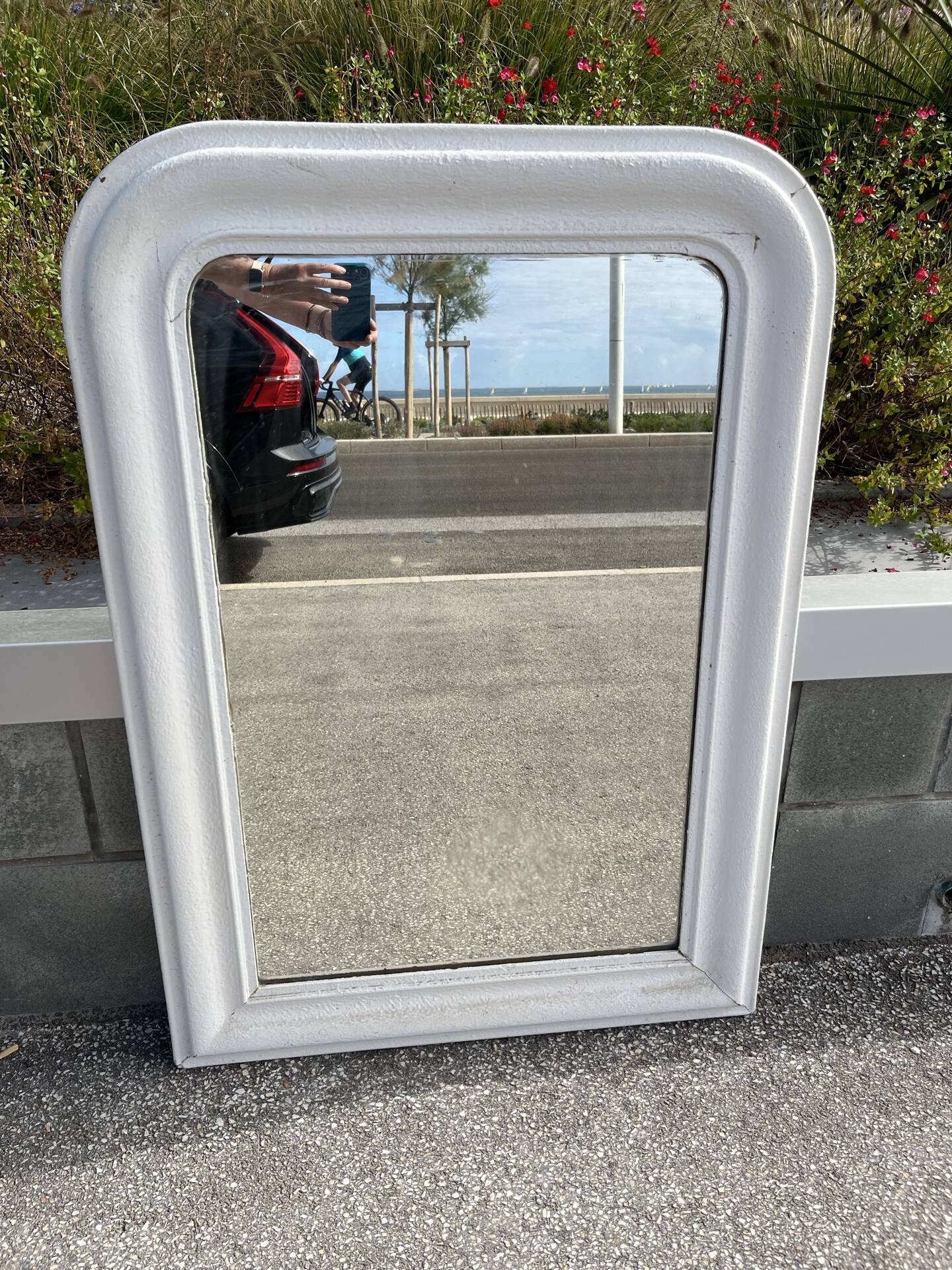 Large white mirror from the early century.