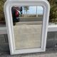 Large white mirror from the early century.