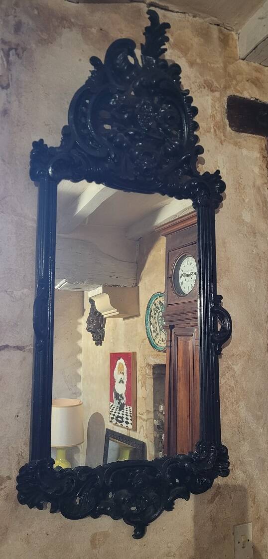 Mirror with carved wooden pediment, late 19th century