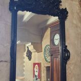 Mirror with carved wooden pediment, late 19th century