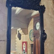 Mirror with carved wooden pediment, late 19th century