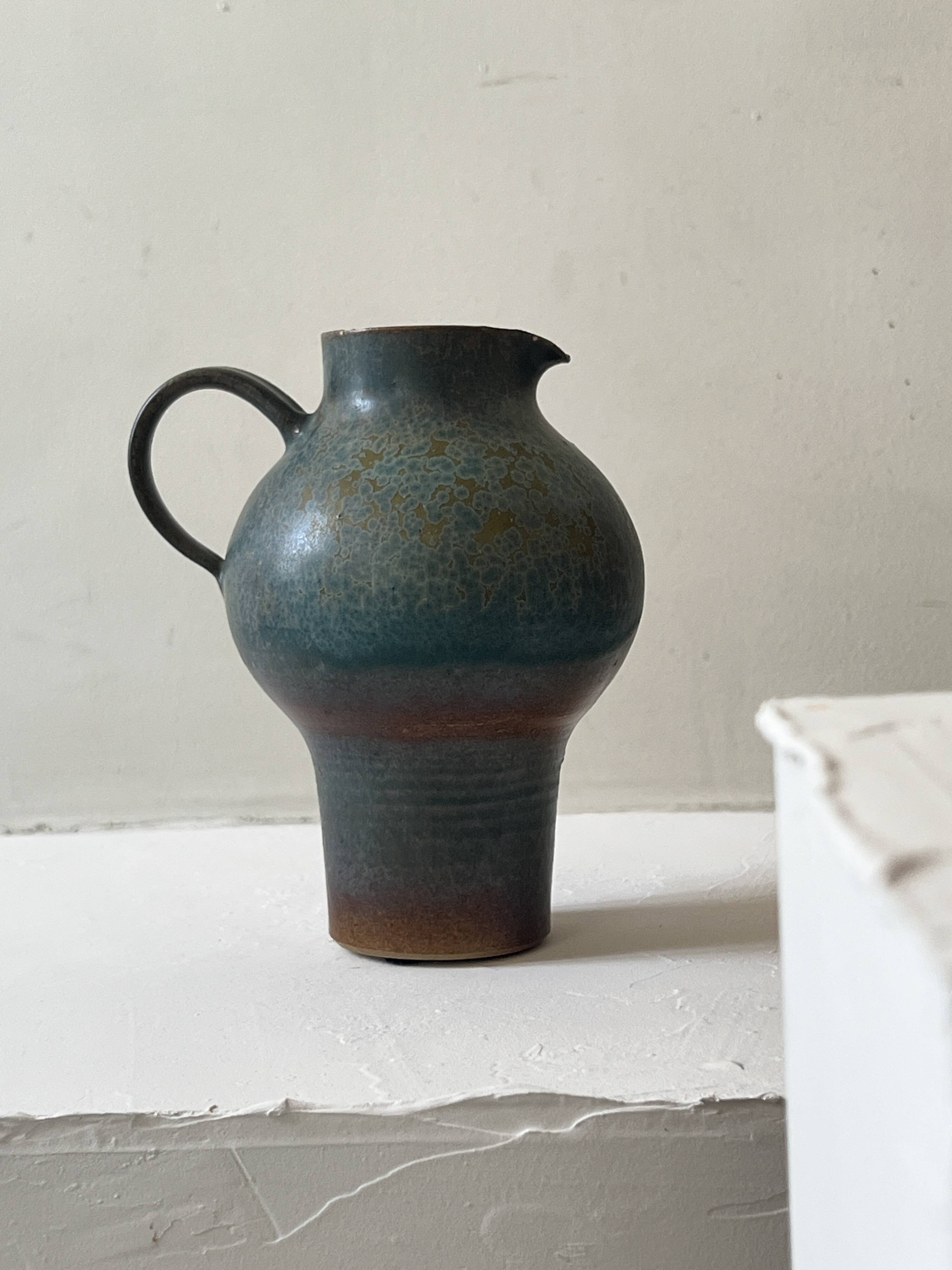 Brownish blue ceramic vase signed AH, France 1950.