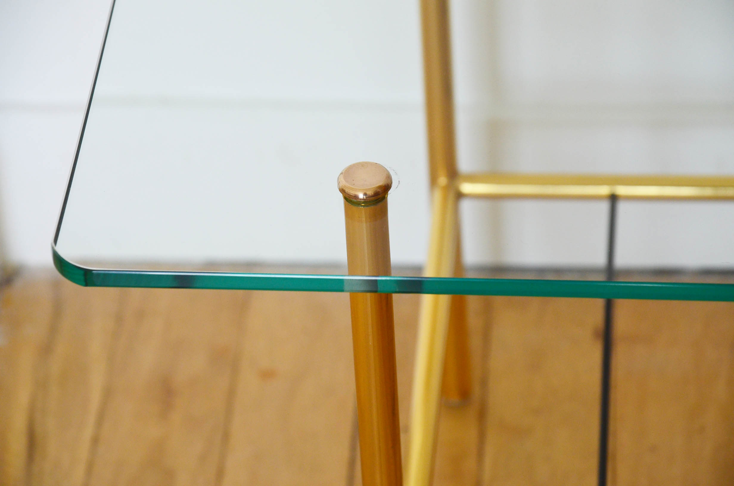 Glass coffee table with magazines holder