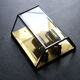 Wall sconce in brass and glass