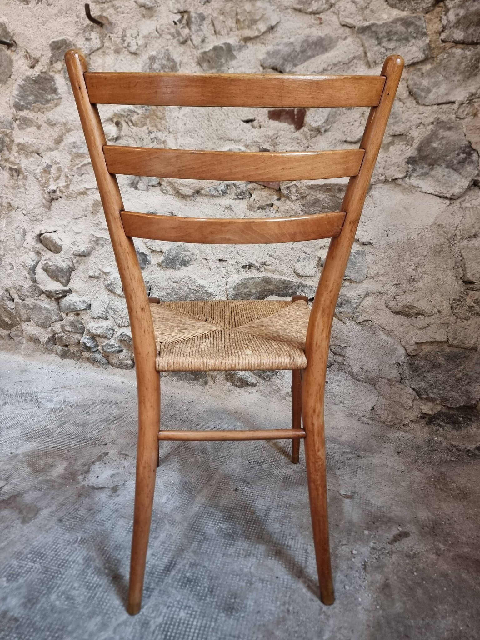 Set of 4 mid-century Italian dining chairs with woven seats, circa 1950–1970.