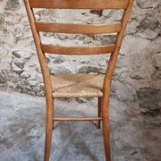 Set of 4 mid-century Italian dining chairs with woven seats, circa 1950–1970.