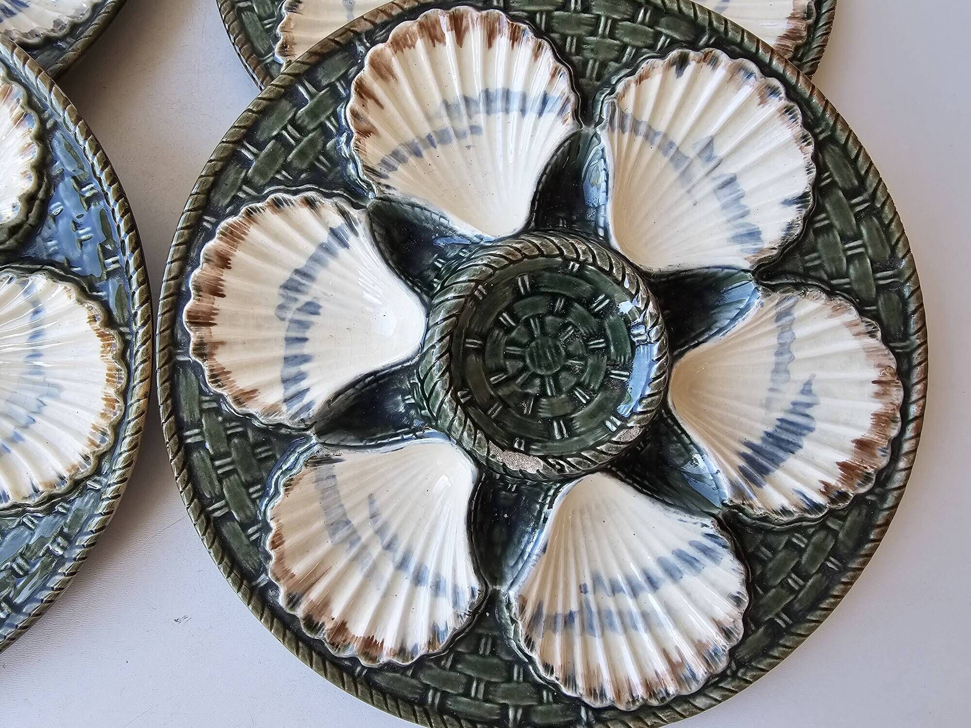 Set of 4 vintage green and white majolica oyster plates.