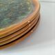 Set of 4 flamed enamel plates in green and amber from the 60s-70s.