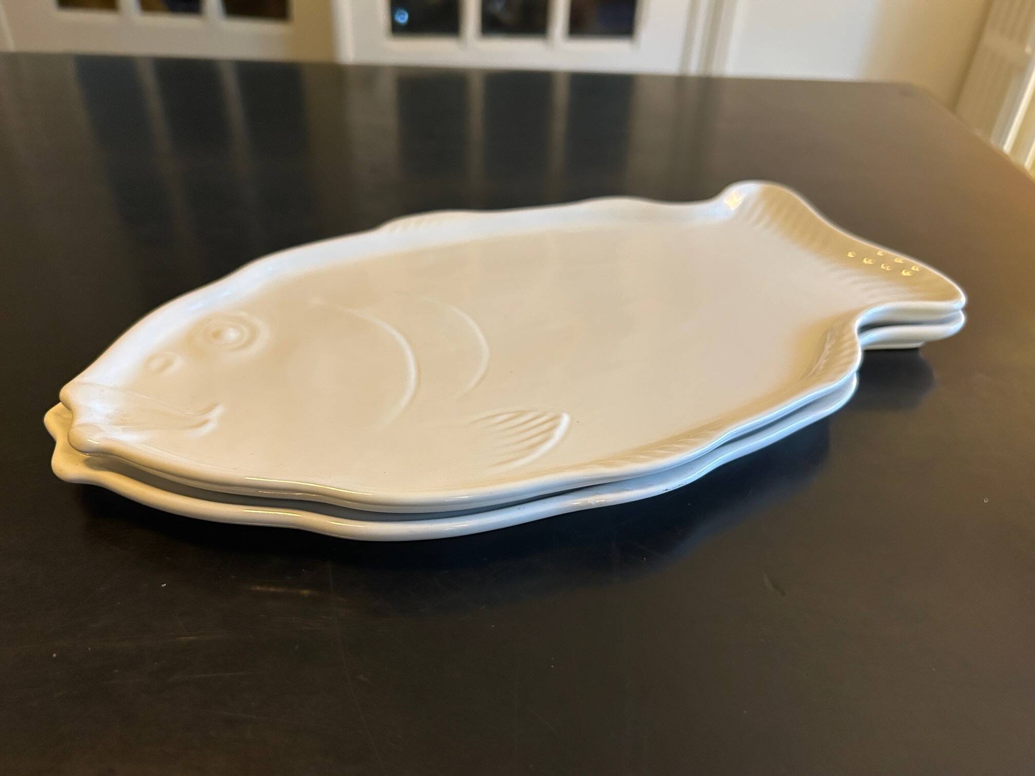 two Revol fish dishes
