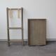 Folding and removable service tray in taupe-painted wood.
