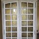 Antique library finished in white with a cerused effect.
