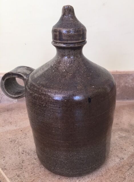 Old liquor service in sandstone, carafe and 5 glasses