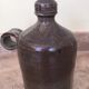 Old liquor service in sandstone, carafe and 5 glasses