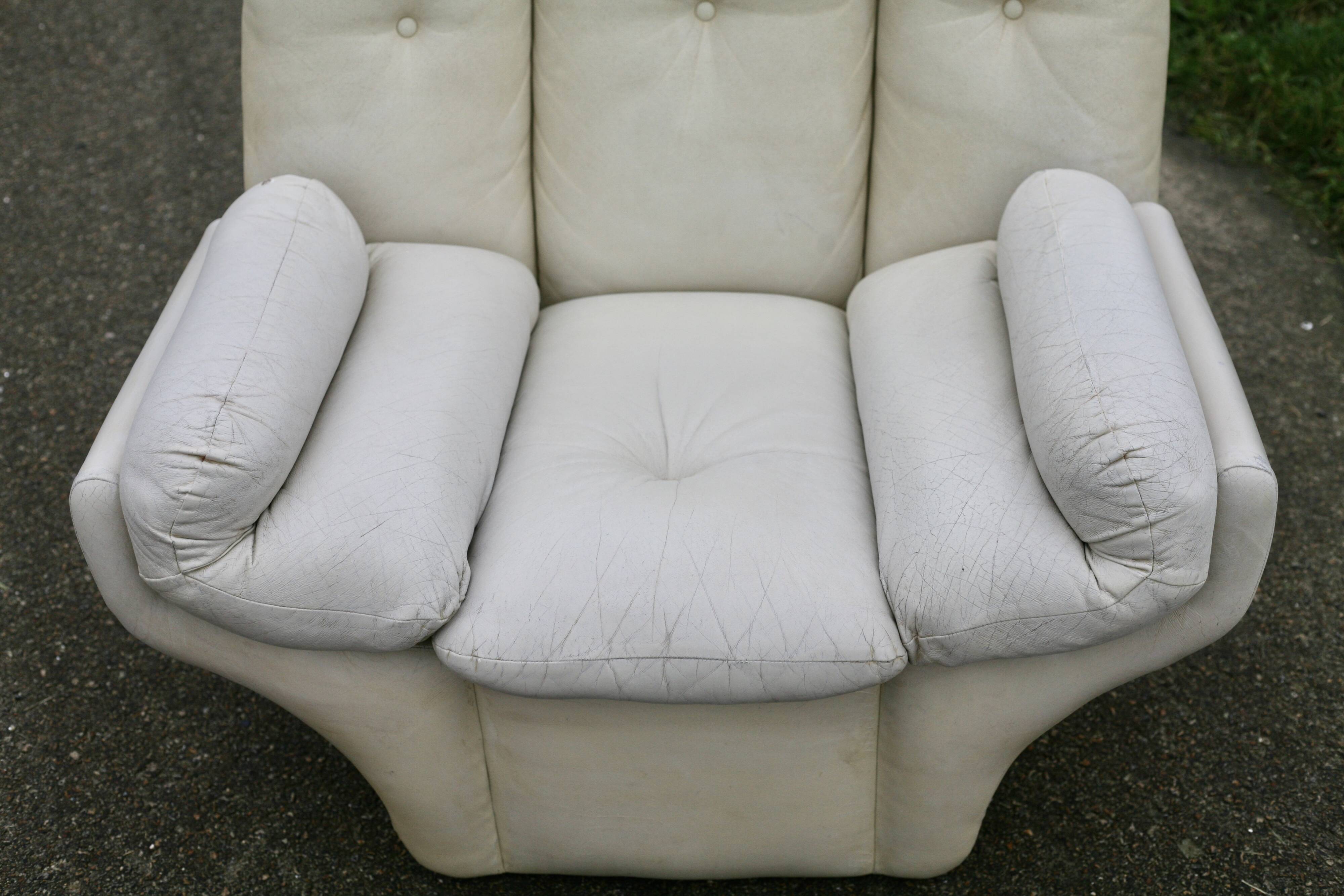 Pair of leather “space age” armchairs. Cream colour". Circa 1970.
