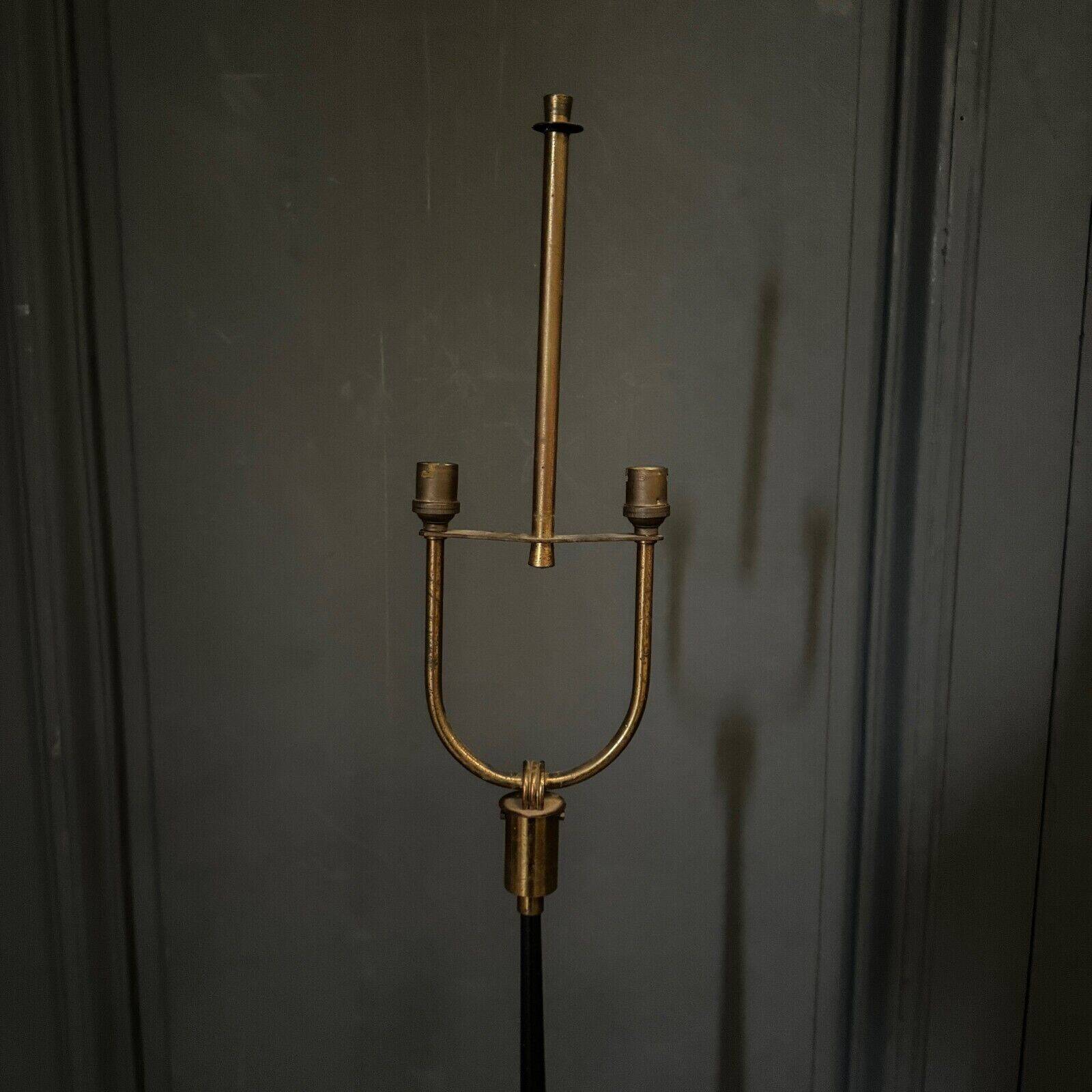 1960 floor lamp on gold metal winged base with black barrel