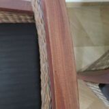 2 colonial-style armchairs in woven rattan and exotic wood