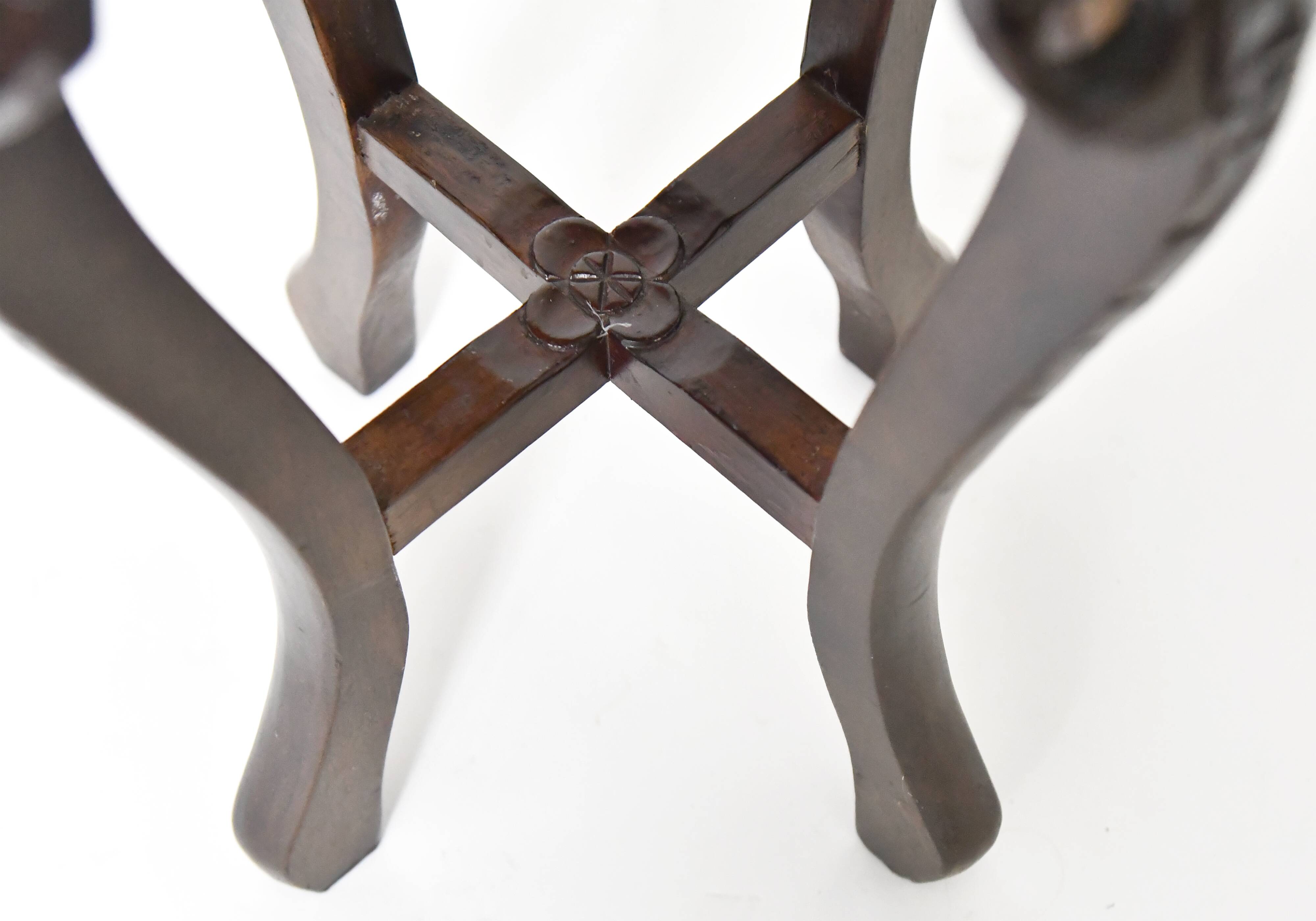 Chinese harness in richly carved wood and marble top