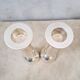 Pair of silver-colored metal candlesticks.