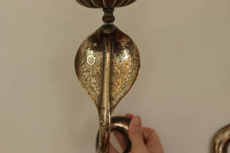 Pair of Neo-Egyptian Style Engraved Brass Wall Sconces Featuring Cobras