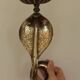 Pair of Neo-Egyptian Style Engraved Brass Wall Sconces Featuring Cobras