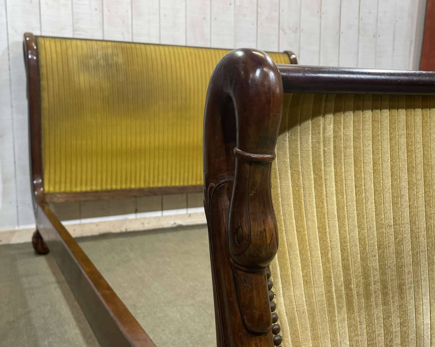 Early 19th century Empire mahogany bed with swan neck finials and claw feet