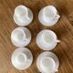 Espresso coffee cup service, Nestlé promotional items, in white glass.