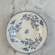 Hollow plate in ironstone from Terre de Feu of Grigny with floral decoration bl