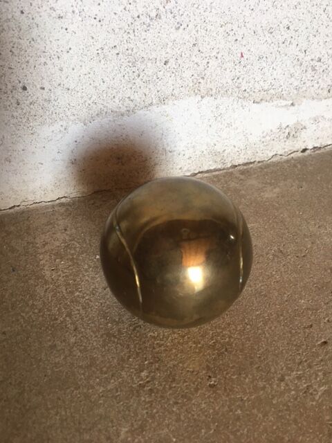 Vintage brass tennis ball