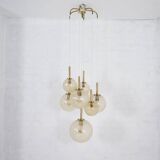“Cascade” brass chandelier with amber globes