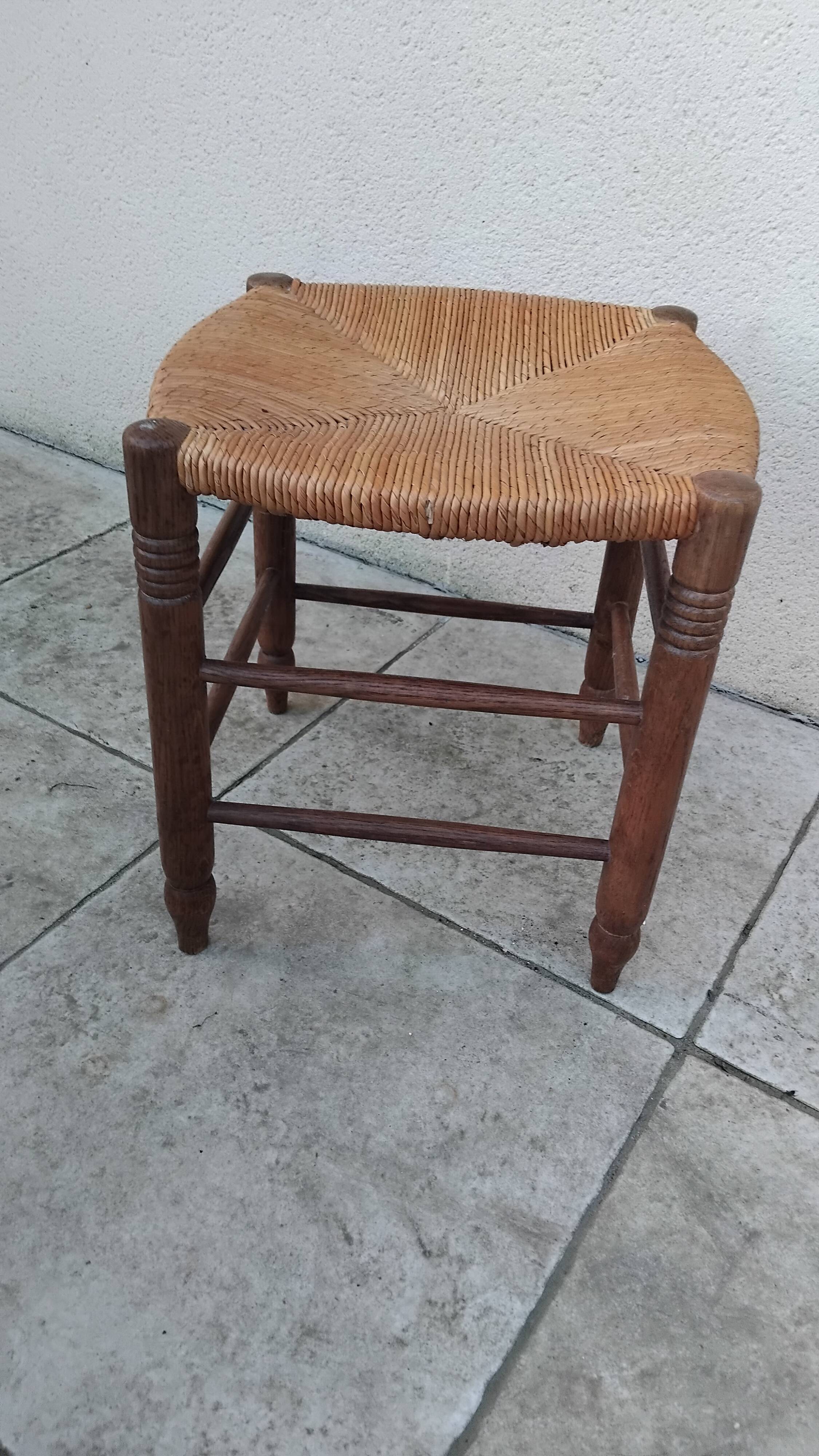 Vintage low stool with straw seat
